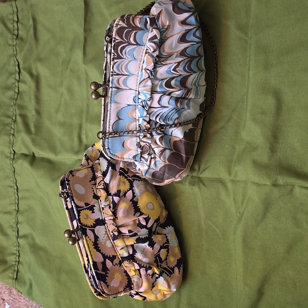 A pair of vintage floral clutch bags